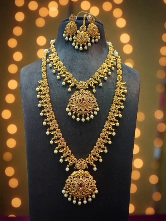 Traditional gold-toned temple jewelry set featuring two intricately crafted long necklaces